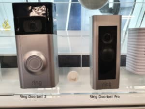 A Ring Doorbell 2 and Ring Doorbell Pro side-by-side, showing how the Pro is much smaller than the '2'.