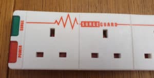 Close-up shot of a surge protected UK 'extension cable' (power strip) using SurgeGuard technology, made by Masterplug.