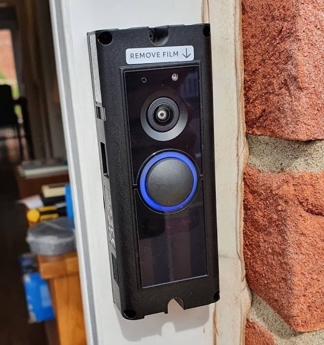 A Ring Doorbell Pro in its initial setup mode - shown by the blue ring.
