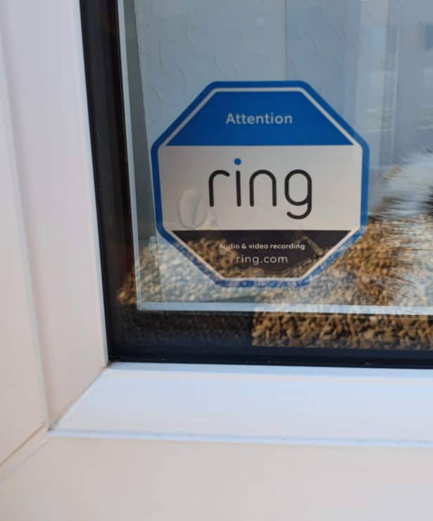 A Ring "Audio & video recording" warning sticker in the window