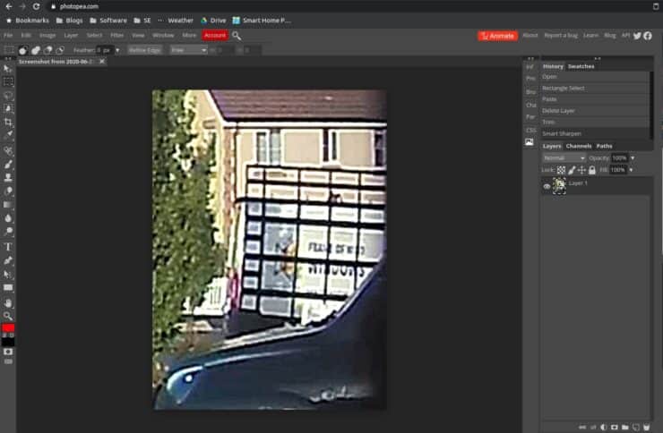 Using Photopea's video editing features to try and make out more information from a parked up van.