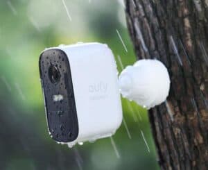 Marketing image of the waterproof eufy camera installed outside when it's raining.