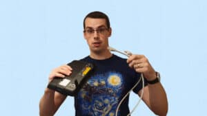 YouTube thumbnail image showing me showing me holding a router and an Ethernet cable.
