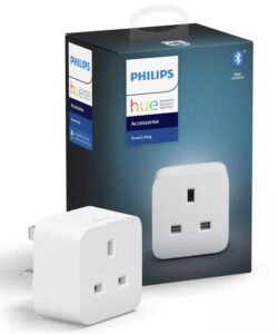 Philips Hue smart plug marketing image showing the Hue smart plug in the foreground, and its box in the background.