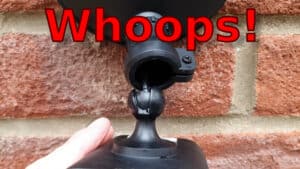 YouTube thumbnail showing a Ring Floodlight Cam hanging from its mount ball socket, and the text "Whoops!"