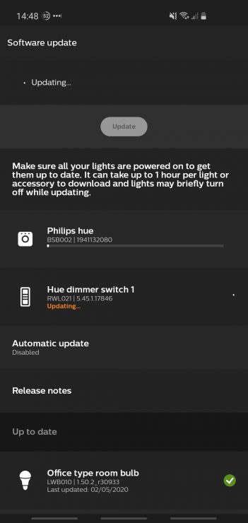 My Hue app showing both the Hue Bridge and Hue dimmer switch being updated