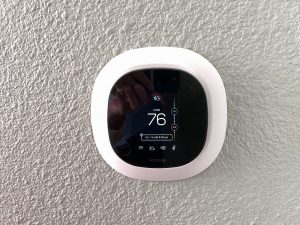 A wall mounted ecobee smart thermostat