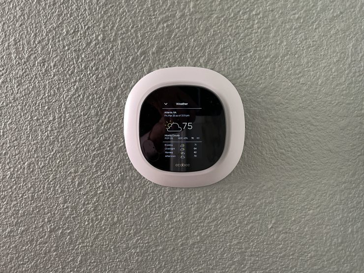 An Ecobee smart thermostat displaying the current weather