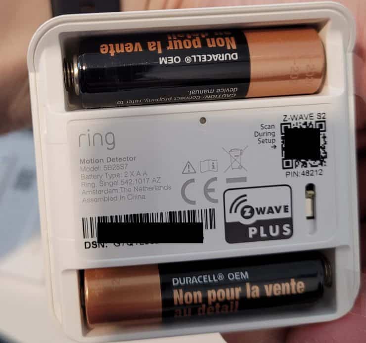 The batteries inside a Ring Motion Sensor with the back cover removed