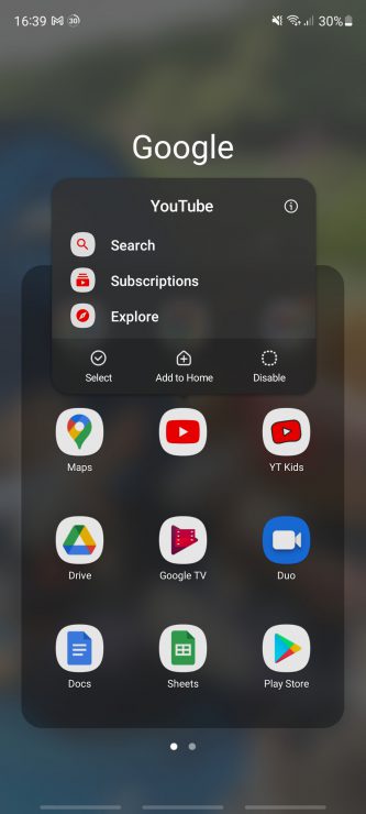 An Android smartphone with the Disable menu highlighted over the YouTube app