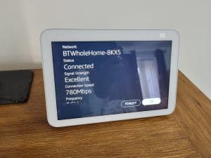 An Echo Show showing the Wi Fi signal strength and other details
