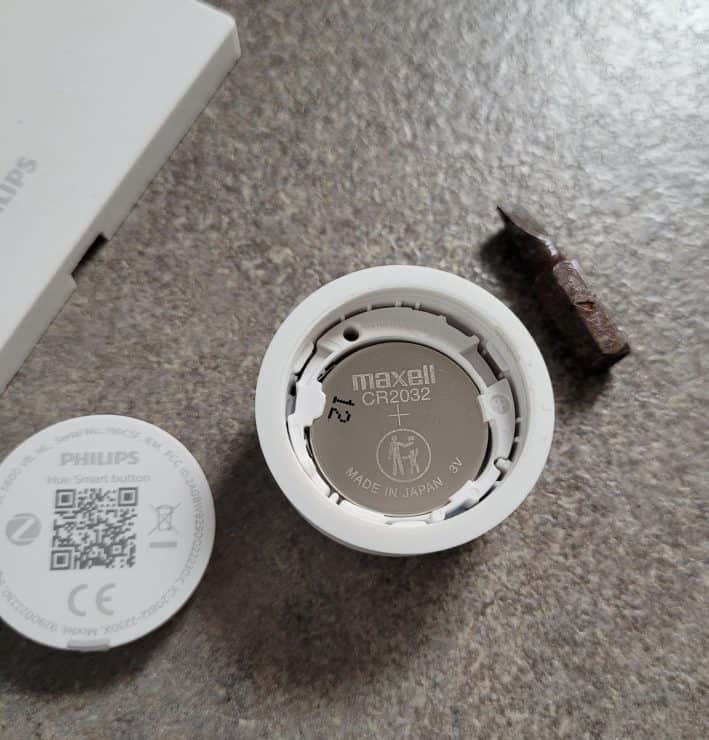 An opened Hue Smart Button showing the CR2032 cell battery inside