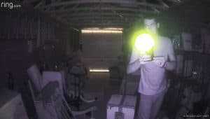 Me shining a phone torch light into a Ring Indoor Cam